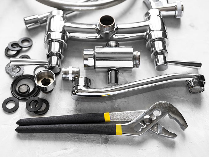 Disassembled chrome kitchen sink faucet